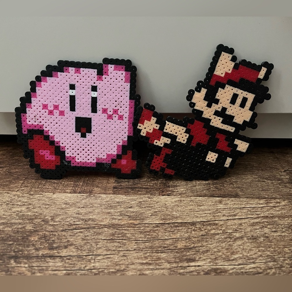 Nintendo Pixel Art with Pink and Red Characters Kirby Mario Tanuki